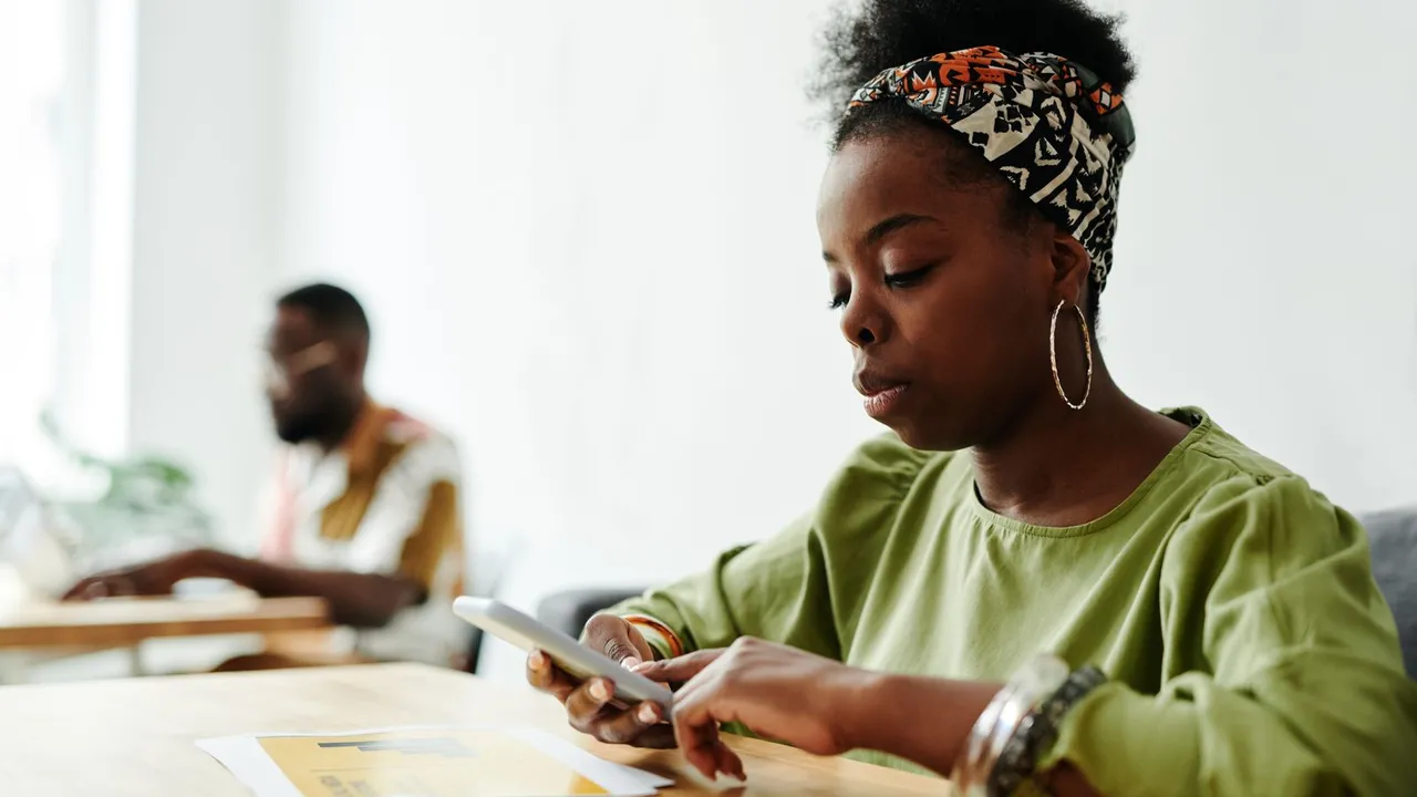 Woman completing an online application on her smartphone